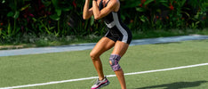 A woman exercises outside while wearing a breathable orthopedic knee brace.