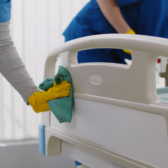 janitorial staff cleaning a clinic or hospital exam room