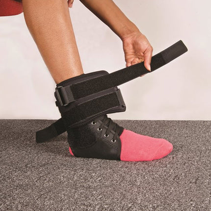 woman straps down Hely & Weber Viseloc Ankle Brace