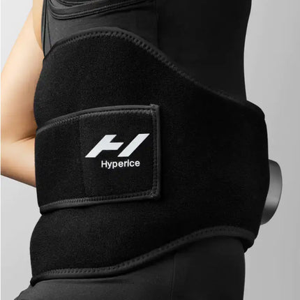 woman wearing the Hyperice Venom 2 Back Heat and Massage Wrap