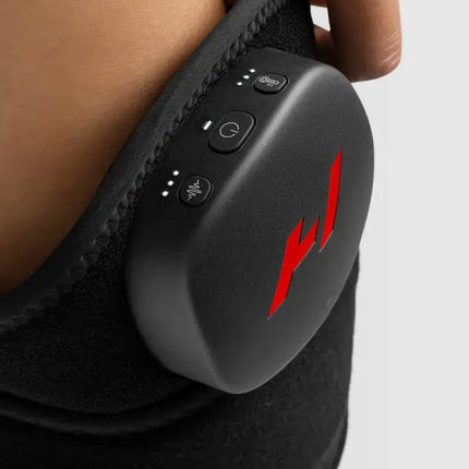 person adjusting the settings of their Hyperice Venom 2 Leg Heat and Massage Wrap