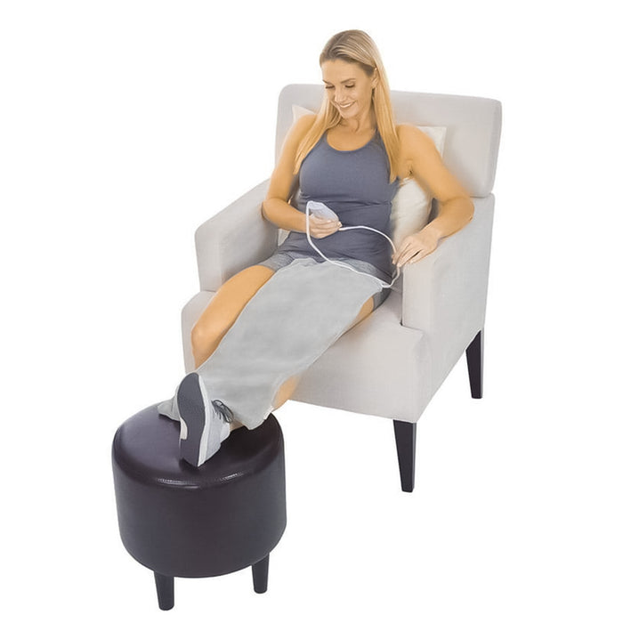 woman using the Vive Health Heating Pad on her leg