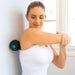 woman using the Vive Health Vibrating Massage Ball to massage her shoulder blade
