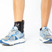 person wearing BioSkin Premium Ankle Compression Brace with sneakers
