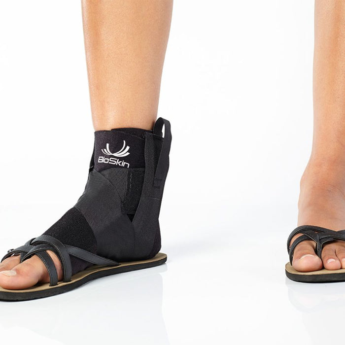 person wearing BioSkin Premium Ankle Compression Brace with sandals