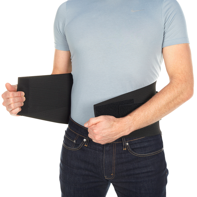 man adjusting Bioskin Lumbar Compression Wrap