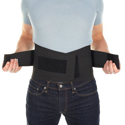 man adjusting Bioskin Lumbar Compression Wrap