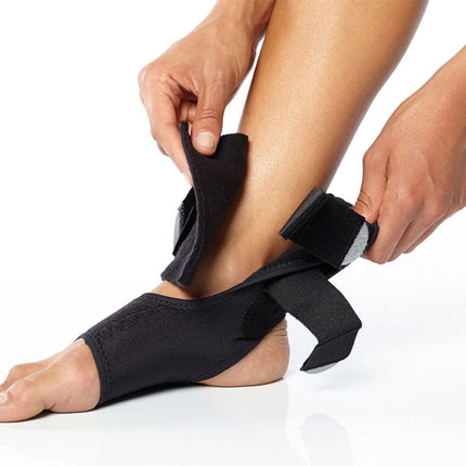 person adjusting BioSkin TriLok Ankle Brace