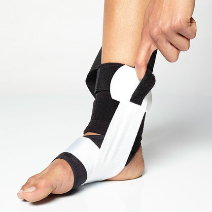 person adjusting BioSkin TriLok Ankle Brace