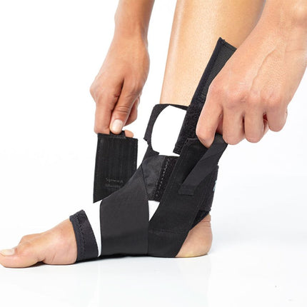 person adjusting BioSkin TriLok Ankle Brace