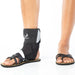 person wearing BioSkin TriLok Ankle Brace with sandals