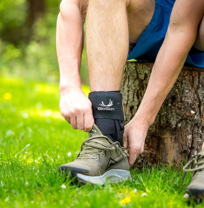 person wearing BioSkin TriLok Ankle Brace with hiking shoes