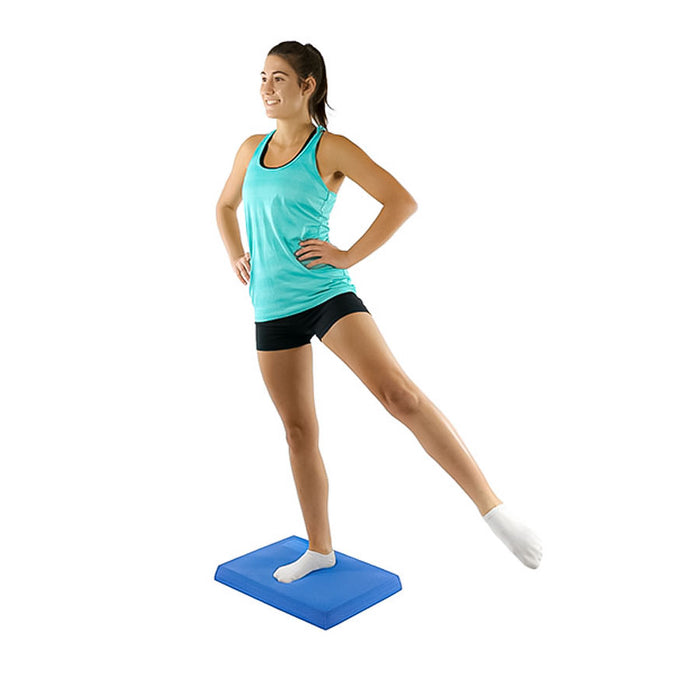 woman using CanDo Balance Pad during exercise