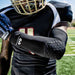 football player wearing McDavid HEX Shooter Arm Sleeve in black