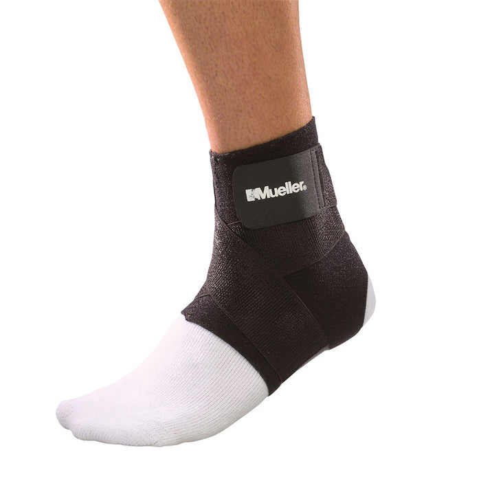 Mueller Ankle Support with Straps on a foot over a sock